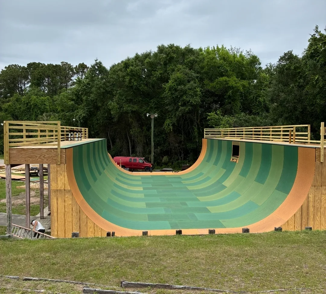 Full view of Kona Skatepark's rebuilt green vert ramp in 2026