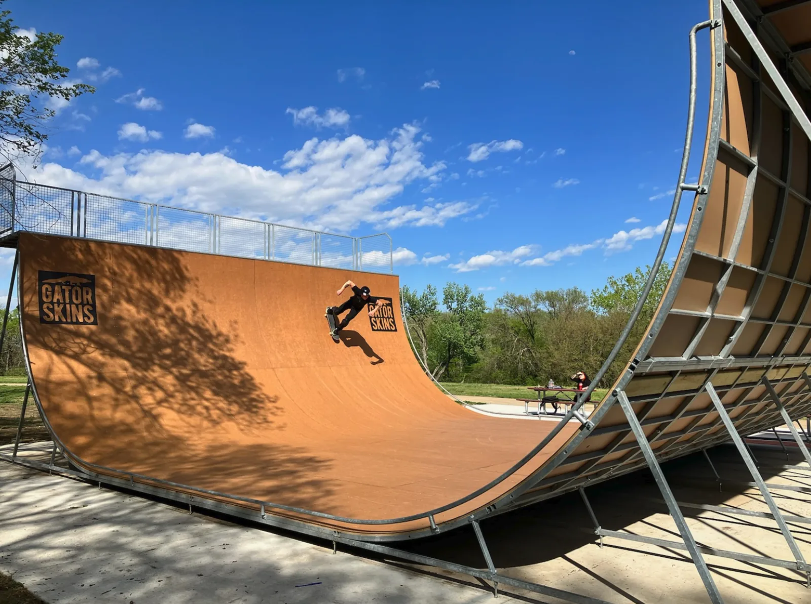 Skater riding the Corey Lawrence Memorial Vert Ramp at Centennial Park